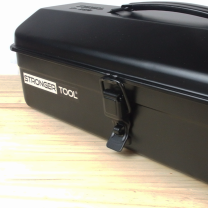 Black tool box with 'Stronger Tool' branding on a wooden surface
