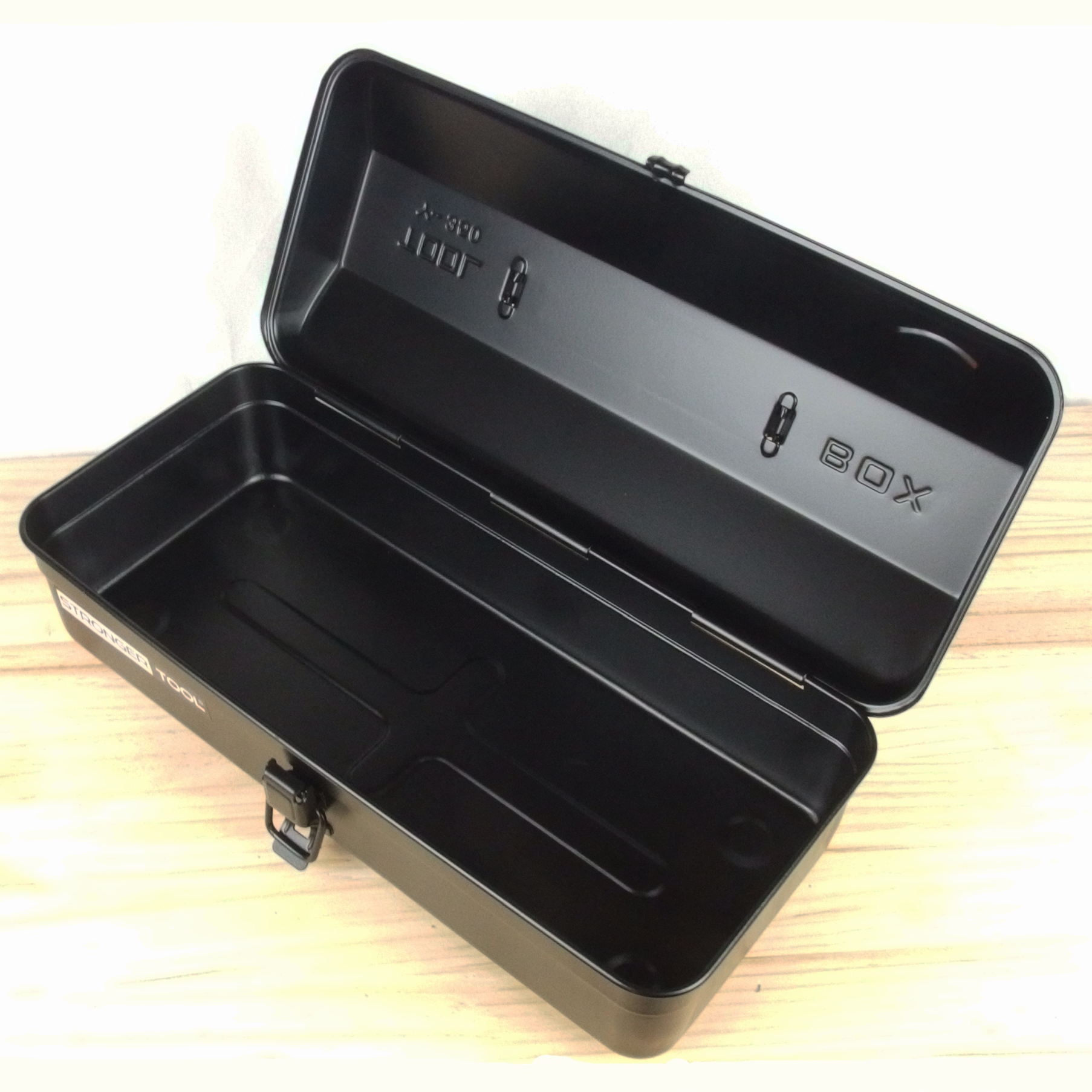 Black toolbox with 'X-Box' branding on a wooden surface