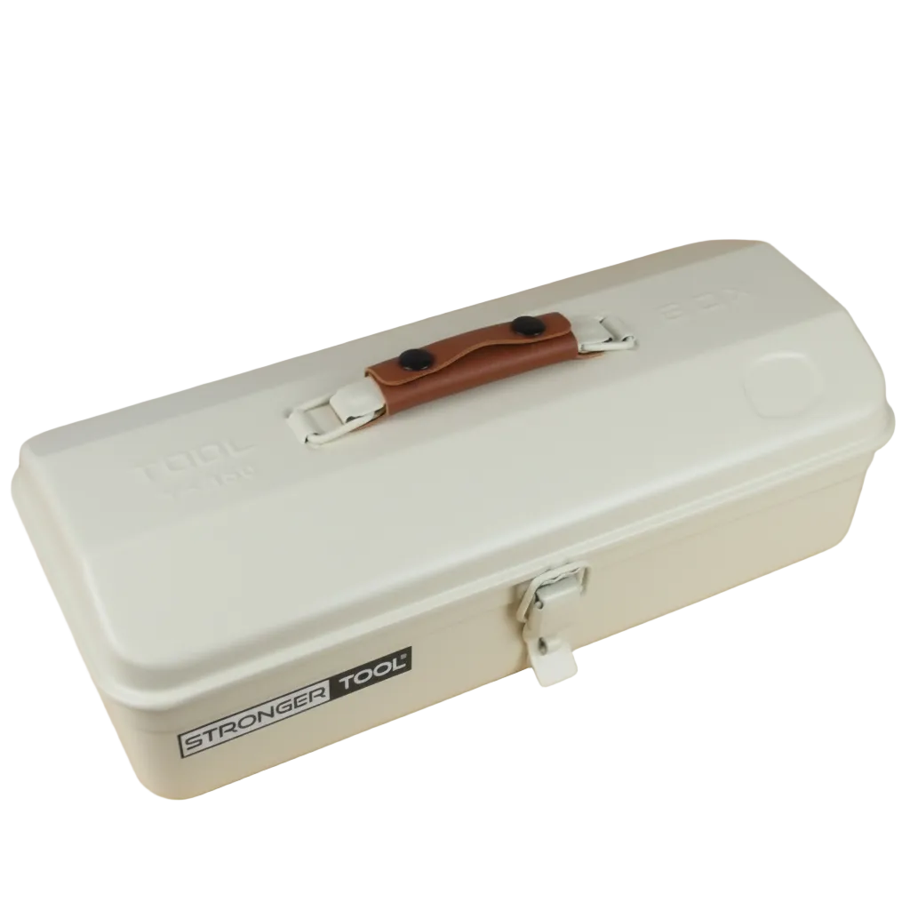 Beige tool box with brown handle on a wooden surface