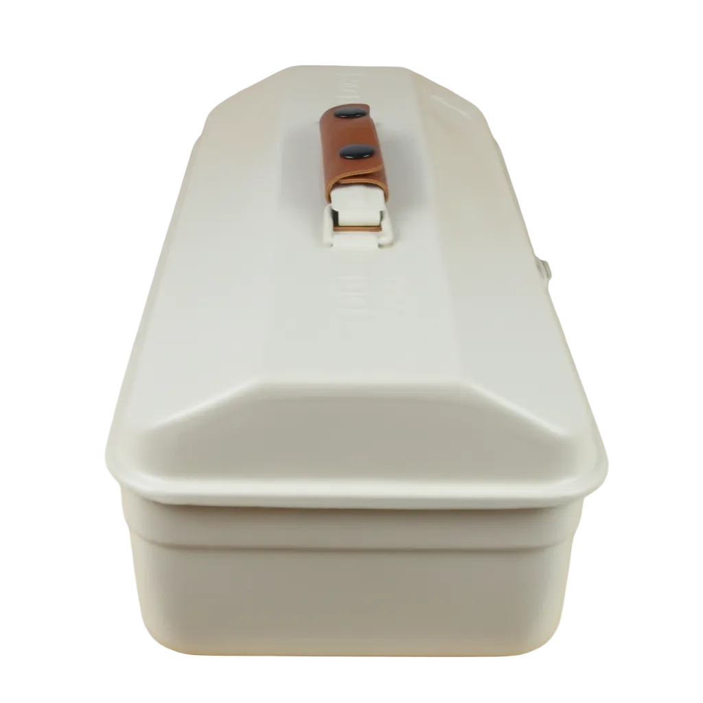 White rectangular container with a brown handle on a wooden surface