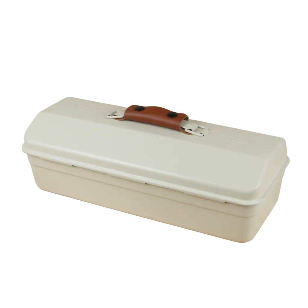 White toolbox with a brown handle on a wooden surface